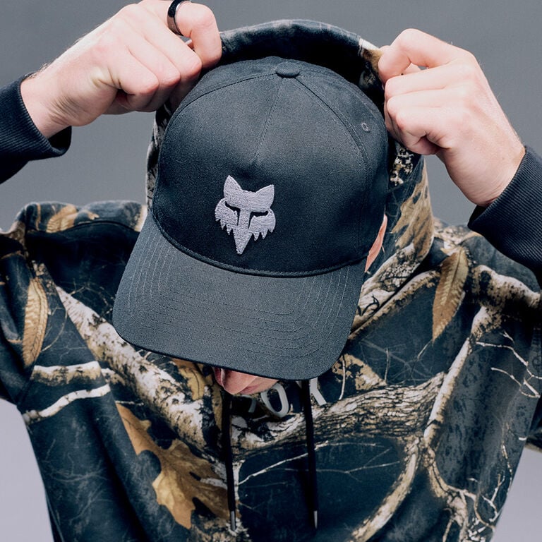 Close up of model with Fox hat and camo fleece